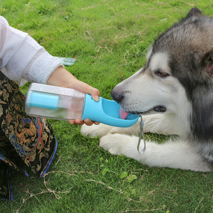 3-in-1 pet water bottle showing water dispenser, food feeder, and poop bag holder