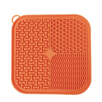 GroveBowl silicone scraper spreading peanut butter into slow feeder grooves
