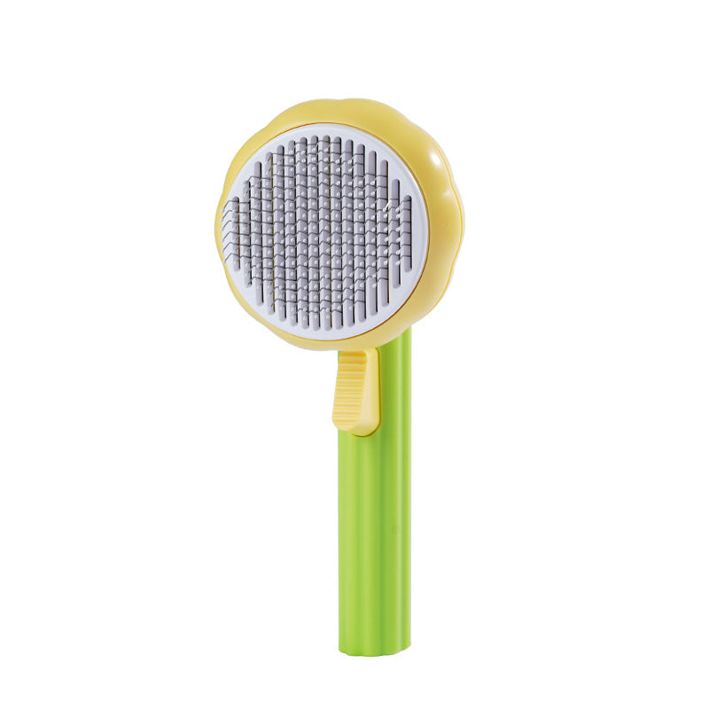 PetGroom self-cleaning massage comb being used to groom a cat or dog — removes loose fur gently

