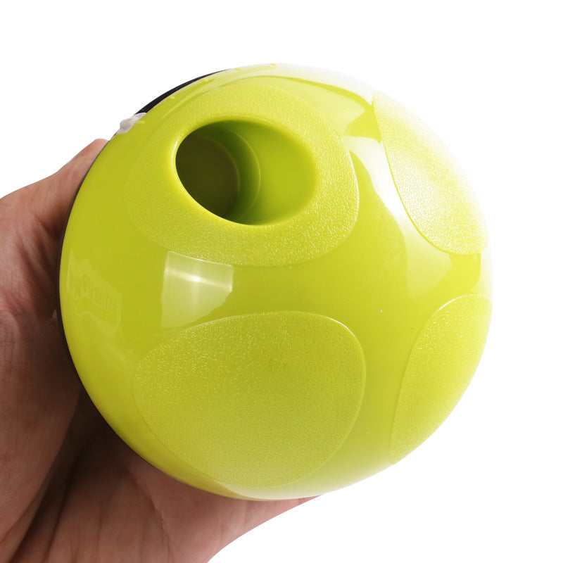 RollReward treat dispenser ball in use with dog rolling toy — slow feeder enrichment ball for dogs and cats

