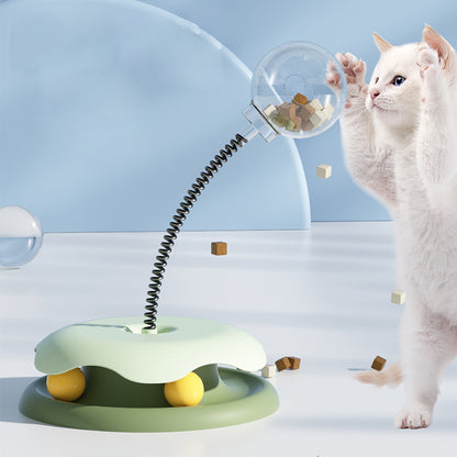 SpringSnack 2-in-1 toy in use with cat pawing spring stem — interactive treat reward play for indoor cats

