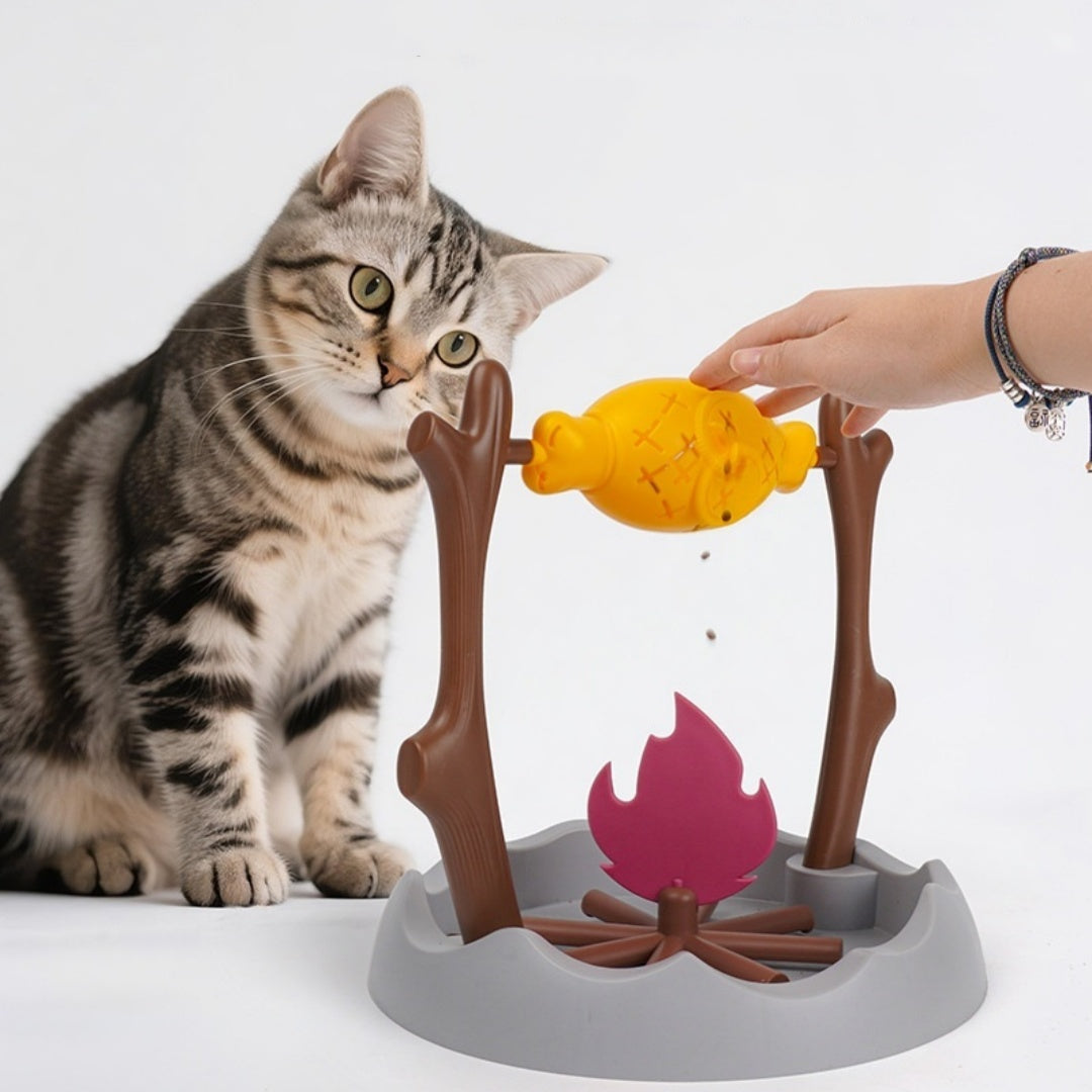 TumbleFeast pet treat dispensing feeder toy BBQ tumbler design for cats and small dogs — lifestyle shot


